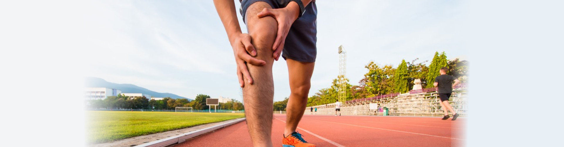 man's hand holding knee joint pain